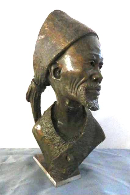 Stone Carving: Gentleman Elder, Measures 14"T x 8" W x 5"D (base missing corner). Weight approx. 15-25 lbs., Signed Artist: James Tandi Title: Chief Counselor Medium: Verdite (James is on the internet)