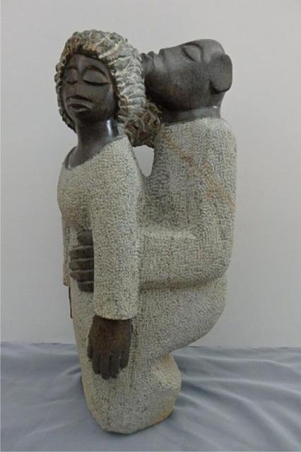 Stone Carving: A Woman and man Embracing-Measures 23"x 9D " x 8"W, Weight approx. 40-50 lbs. Artist: Chaka Title: You and Me Medium: Spring stone