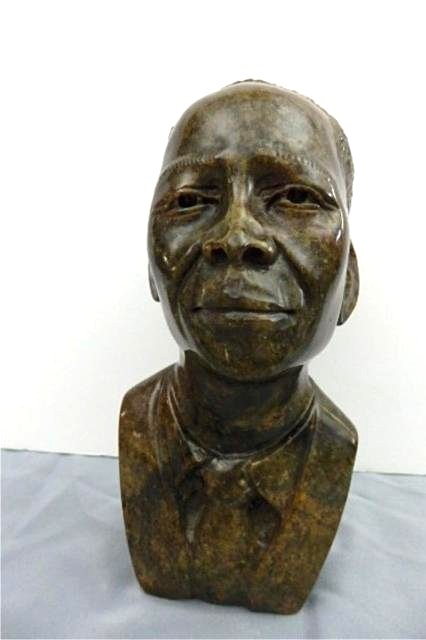 Stone Carving: Measures 9.5" x 4.5"X 5" Weight approx. 5-10 lbs. Artist: Eliot Title: Obama Medium: Serpentine