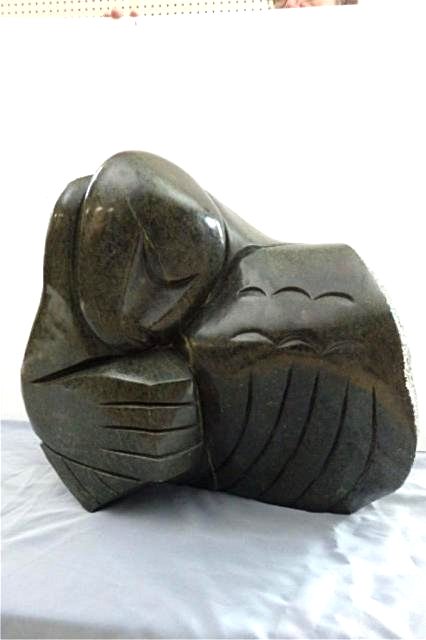 Stone Carving: Profile of Woman, measures 19" x 22" x 11", Weight approx 80-100 lbs Artist: Ngoni Tandi Title: Woman Medium: Fruit stone