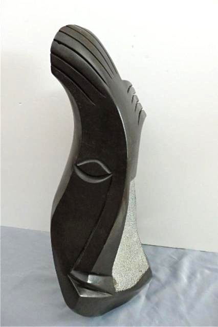 Stone Carving: Abstract Face Signed Simba/ Mteki, measures 25" x 13" x 7", weight 40-60 lbs Artist: Richard Mteki & Simba Title: Eagle Spirit Medium: Spring stone (Protected by an Eagle Spirit)