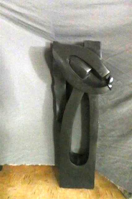 Stone Carving: Abstract, measuring 47"H x 17" x 13" D, weight apprx 300-400 lbs Artist: Choloka/Simba Title: Crowned Warrior Medium: Spring stone