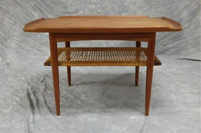 Coffee Table: Coffee Table with wicker shelf made by Selig, with Selig manufacturerï¾’s button affixed, 19" high x 30" long x 20" wide.