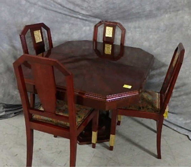Art Deco Five Piece Table and Chairs: Octogonal lacquer table with single pedestal base, one leaf, 29" x 63" including leaf , there are five velvet seat chairs with gilt Art Deco deocration on chair back and legs.