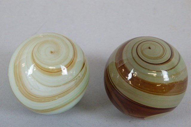 Lot of Two Antique Gear Shift Knobs: Two 1.75" brown swirl antique gear shift knobs.