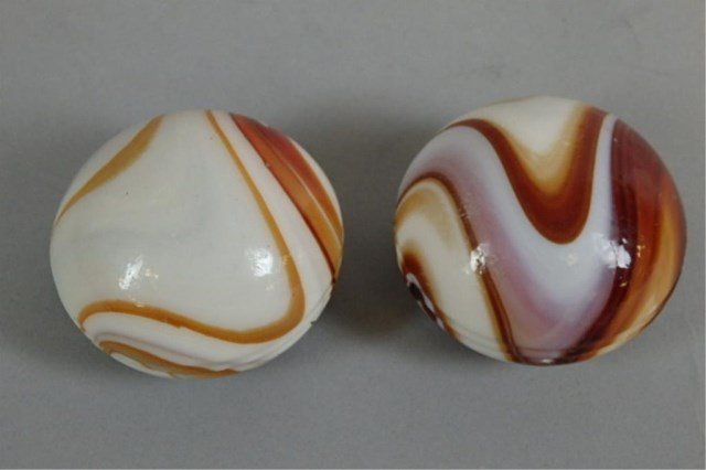 Lot of Two Antique Gear Shift Knobs: (2) 1.5" x 2" brown swirl antique gear shift knobs.