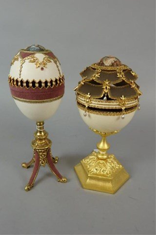 Lot of Two Elaborate Hand-Carved Large Eggs: Lot of two large elaborate hand-carved eggs - one is10" decorated, hinged to open to a jewelry box; other is 10.5" decorated, hinged to open to a jewelry box, made by Glenroy Dankel, unique and one of