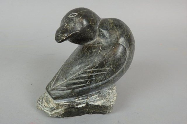 Inuit Carving: 6" x 6" x 5" image of a bird seated on a rock, marked on bottom with numbers, no signature.