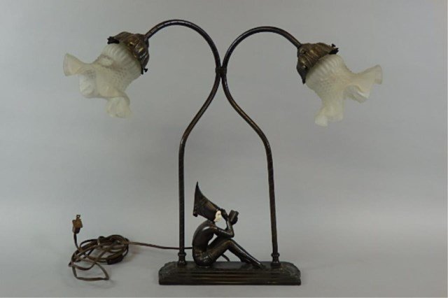 Art Deco Table Lamp: 19" tall x 10" long x 4" wide Art Deco table lamp of a seated figure reading, two frosted shades.