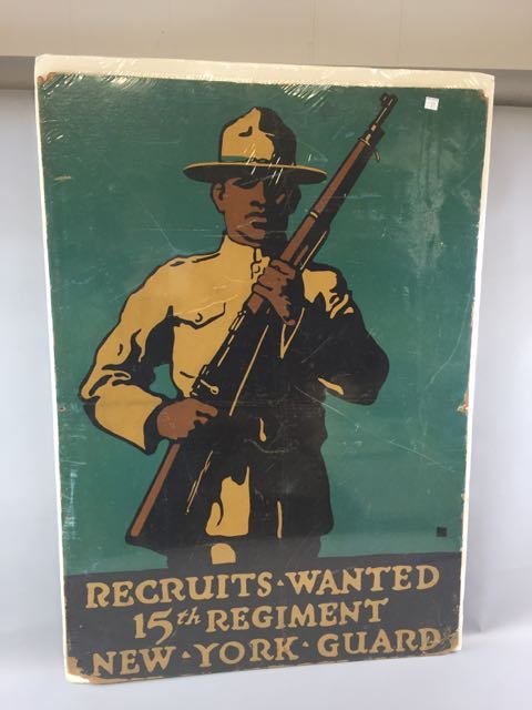 15th Regiment NY Guard Poster WWI: 37" tall x 26" w x .25" thick recruitment advertising poster on board. "Recruits Wanted, 15th Regiment, New York Guard." Poster depicts a black soldier on green background holding rifle. The 15th beca