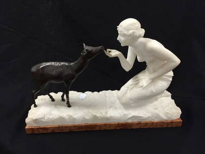 Dante Zoi Carved Marble and Bronze Sculpture: Carved Italian white Carrara marble and bronze sculpture, 16 1/2 inches tall x 24 inches long x 8 inches deep, depicting a scantily dressed woman kneeling in front of a young buck. The woman and platf