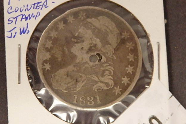 HALF DOLLAR: 1831 G COUNTER STAMPED "JW"