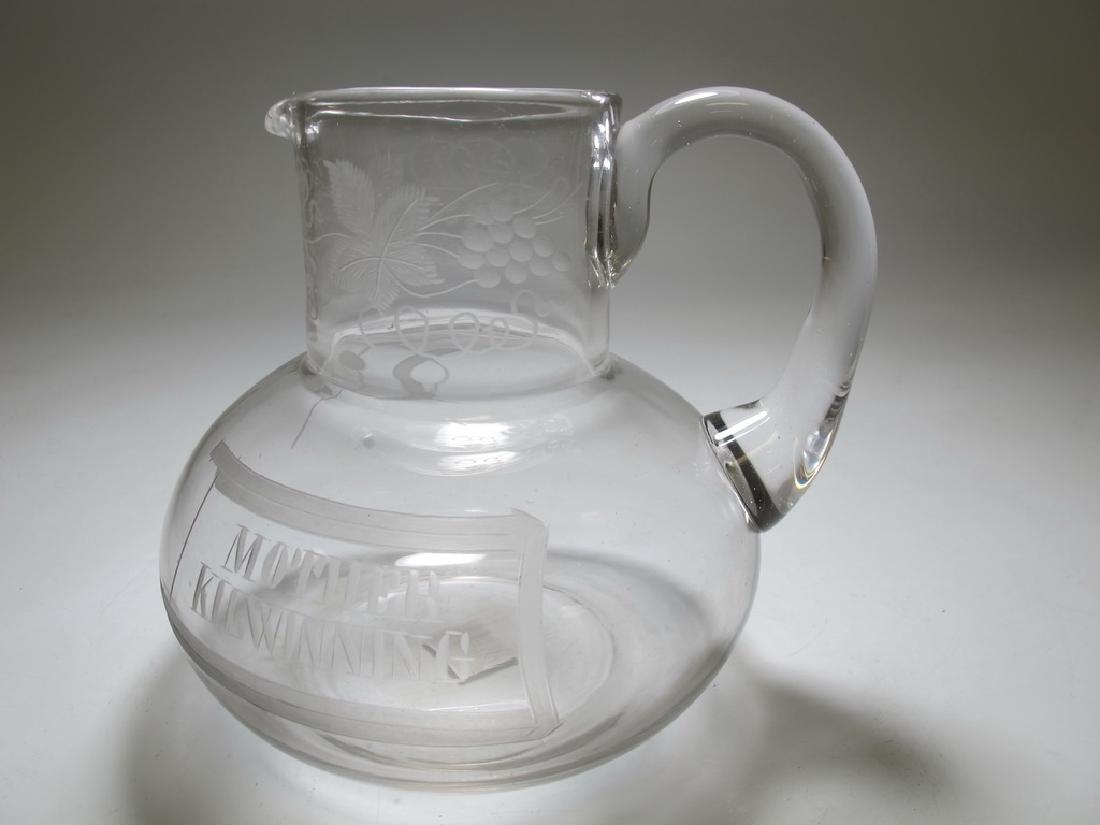 Small Masonic English glass water jug c. 1870: Small Masonic English glass water jug c. 1870. Engraved with fruiting vines, set square and compass. On the other side it is engraved "œMother Kilwinning", a Masonic Lodge in Scotland, which is reput