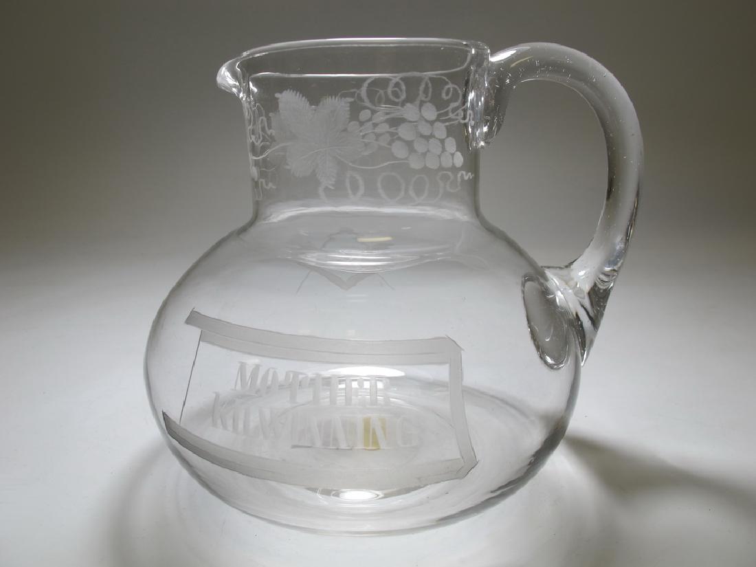 Victorian Masonic English glass water jug c. 1870: Victorian Masonic English glass water jug c. 1870. Engraved with fruiting vines, set square and compass. On the other side it is engraved "œMother Kilwinning", a Masonic Lodge in Scotland, which is r