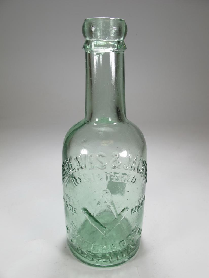 Antique English Masonic green glass bottle: Antique English green glass bottle with Masonic symbol and relief "œHarcreaves & Jackson Registered Trade Mark Waterfoot Rossendale. 7 5/8" H x 2 3/4" D. Shipping in USA or International please conta