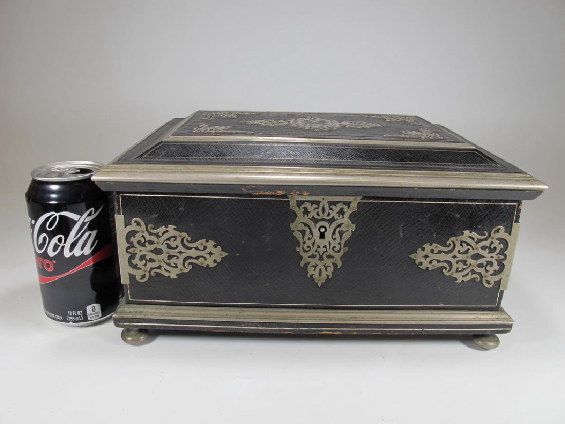 Antique Masonic footed wood box with metal deco: Antique footed, wood box with metal decor and leather. Blue lining. 6" H x 11 3/8" W x 8 1/8" D. Shipping in USA or International please contact : James Lawrence from the local UPS Store, 954-463-0444
