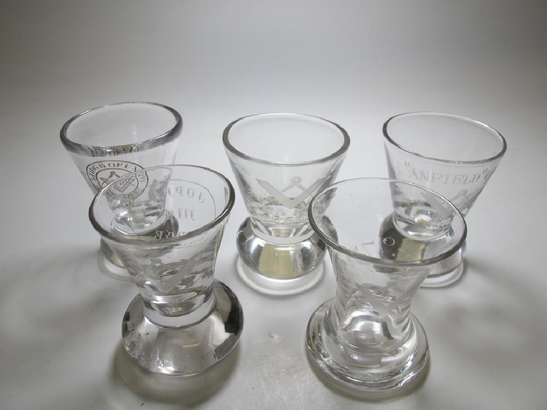 Lot of 5 Masonic etched firing glasses: Lot of five Masonic etched firing glasses. One glass is engraved the Masonic symbol compass and square set on one side and JOPPA 1114 Lodge on the other side. One glass is engraved with Lodge of Unity