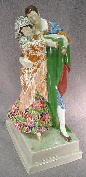 Goldscheider Art Deco porcelain couple statue: Goldscheider Art Deco porcelain couple statue, marked and signed. 16 3/4"H x 9 1/2"W x 6 1/4"D. Shipping in USA is $ 60.00. International bidders ask before bid.