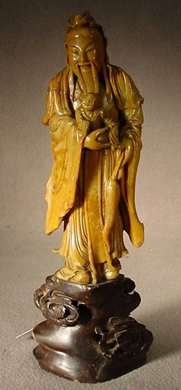 Chinese carved soapstone figure: Chinese hand carved soapstone figure. 10"H x 3 1/2"W. Shipping in USA is $ 25.00. International bidders ask before bid.