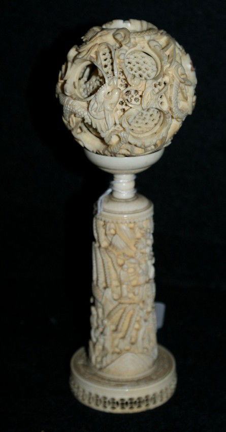 Chinese carved ivory puzzle ball: Chinese carved ivory puzzle ball on a stand. 7"H. Shipping in USA is $ 25.00. International bidders ask before bid because we don't ship ivories out of USA.