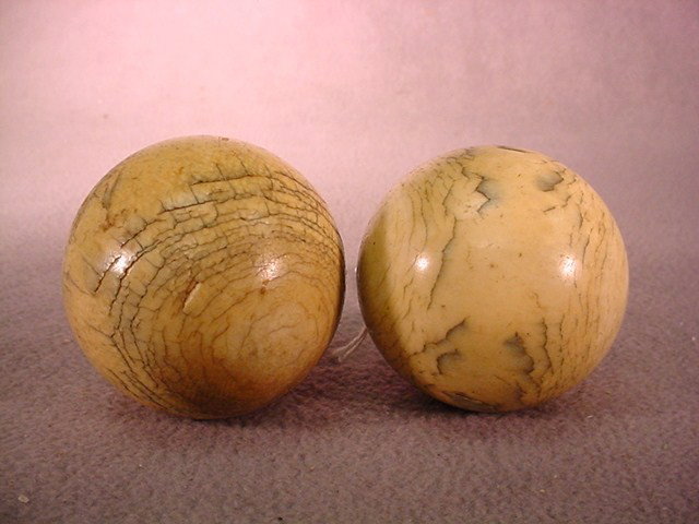 Antique pair of ivory balls: Antique pair of ivory balls. 2 1/8" diameter. Shipping in USA is $ 20.00. International bidders ask before bid.