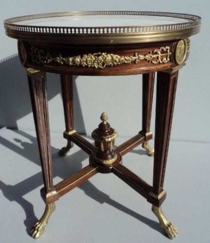French empire table in the manner of F. Linke: French empire mahogany table in the manner of F. Linke, with bronze details and marble top. 30 1/4'' H x 29 1/4'' W x 25 1/4" D. Shipping in USA is $ 150.00. International bidders ask before bid.