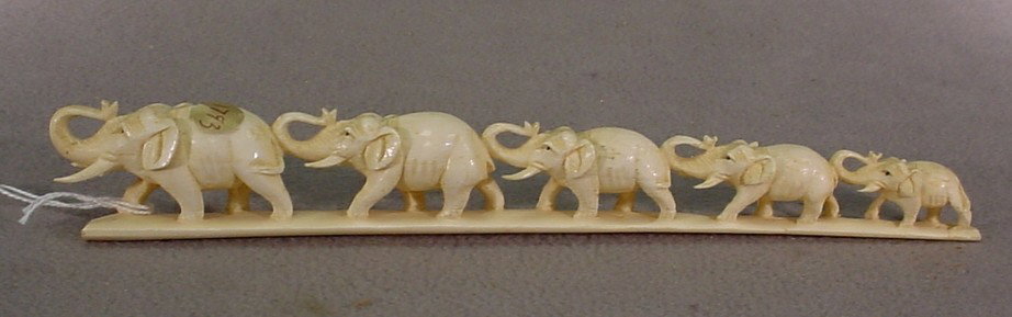 Old Chinese carved ivory elephants: Old Chinese carved ivory elephants. 1 3/8" H x 9 1/8" W. Shipping in USA is $ 30.00. International bidders ask before bid.