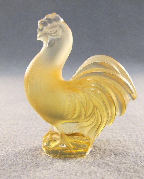 Lalique molded yellow rooster: Lalique molded yellow rooster, signed. 2 7/8" high. Shipping in USA is $ 20.00. International bidders ask before bid.