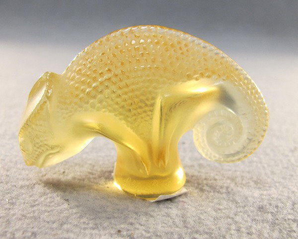 Lalique molded yellow chameleon: Lalique molded yellow chameleon, signed. 1 3/4" high. Shipping in USA is $ 20.00. International bidders ask before bid.