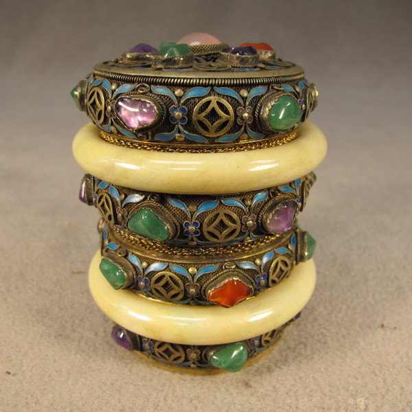 Chinese silver enamel round box: Chinese silver filigree enamel, jade and precious stones round lidded box, marked. 3 7/8" H x 3 1/8" W. Shipping in USA is $ 25.00. International bidders ask before bid.