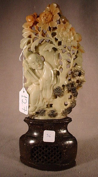 Chinese carved soapstone figure: Chinese hand carved soapstone figure of man and flowers, circa 1920. 9 3/4"H x 2 1/4"D x 4 3/4"W. Shipping in USA is $ 25.00. International bidders ask before bid.
