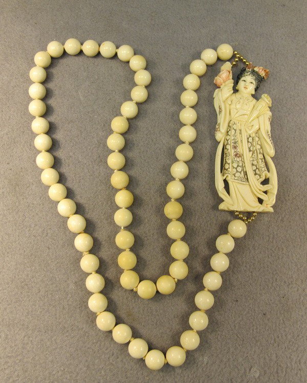 Chinese carved ivory necklace: Chinese hand carved ivory figure plaque and balls necklace. 31" long and the plaque is 4 1/4" H. Shipping in USA is $ 20.00. International bidders ask before bid.