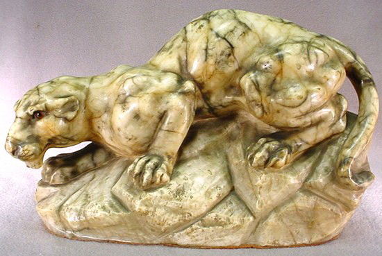 French Art Deco alabaster panther statue: French Art Deco alabaster panther statue with glass eyes. 9" H x 13" W. Shipping in USA is $ 55.00. International bidders ask before bid.
