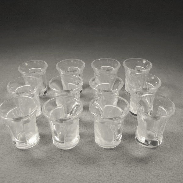 Lalique set of 12 glasses: Lalique Art Deco set of 12 glasses, marked. 2'' H x 1 5/8'' W. Shipping in USA is $ 60.00.International bidders ask before bid.