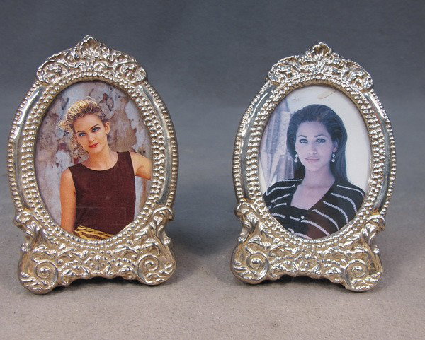 Pair of sterling 925 picture frames: Pair of sterling 925 picture frames, marked. 4 3/8" H x 2 5/8" W (picture is 2 1/2" H x 2" W). Shipping in USA is $ 25.00.