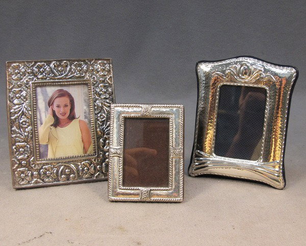 Set of 3 sterling 925 picture frames: Set of 3 sterling 925 picture frames, marked. 4 3/4" H x 4" W, 4 7/8" H x 3 3/4" W and 3 3/8" H x 2 9/16" W. Shipping in USA is $ 30.00.