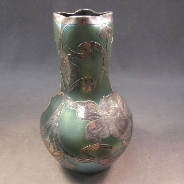 Loetz sterling silver overlay glass vase, unsigned: Sterling silver overlay Art Nouveau Loetz glass vase, unsigned. 10" H. Shipping in USA is $ 30.00. International bidder ask for shipping before bid.