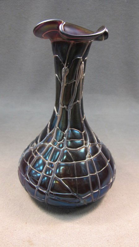 Loetz style iridescent glass vase: Loetz style iridescent glass vase. 8 5/8" H. Shipping in USA is $ 35.00. International bidder ask for shipping before bid.