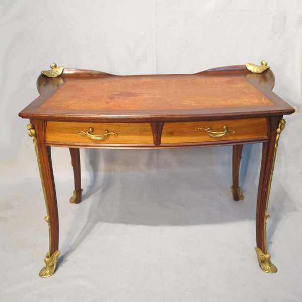 Great French Art Nouveau walnut leather desk: Probably by Louis MAJORELLE (1859-1926) French Art Nouveau walnut, bronze & leather desk, unsigned. 30 3/4" H x 47" W x 28 3/4" D. Shipping in USA is $ 350.00. International bidder ask for shipping be