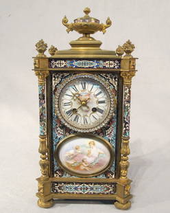 Bronze champleve & porcelain clock: Bronze champleve & porcelain clock. 17'' H x 8" W. Shipping in USA is $ 30.00.International bidder ask for shipping before bid.