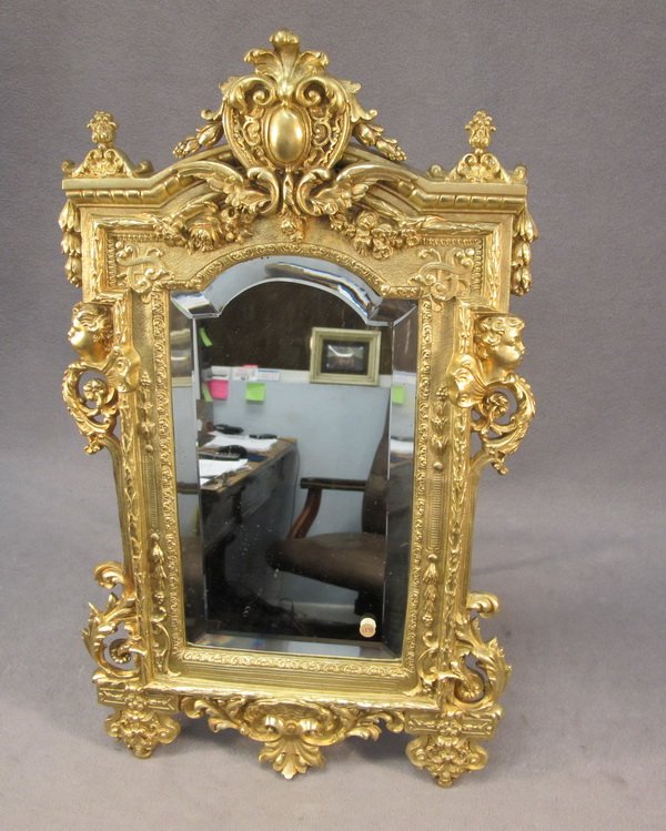 French bronze vanity mirror: French bronze & bevelled glass vanity mirror. 23 5/8" H x 13 5/8" W. Shipping in USA is $ 45.00.International bidder ask for shipping before bid.