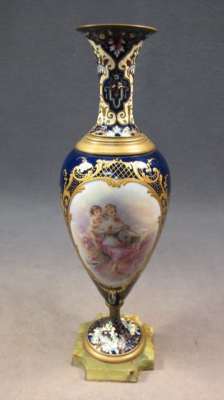 French Sevres champleve urn: French Sevres champlevé bronze & porcelain urn on an onyx base. Signed paintings. 12 1/4" H. Shipping in USA is $ 45.00. International bidders ask before bid
