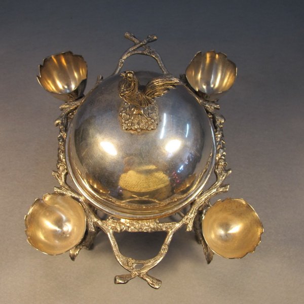 English EPNS silver-plate egg stand: English EPNS silver-plate egg cup stand, marked. 10" H x 8 1/4" W x 7 1/2" D. Shipping in USA is $ 45.00. International bidders ask before bid.