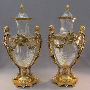 20th C. Baccarat pair of glass & bronze urns: 20th C. Baccarat pair of glass & bronze urns, marked. 29" H x 14 1/2" W. Shipping in USA is $ 145.00. International bidders ask before bid.