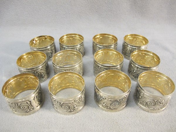 Ravinet D'Enfert, Paris set of 12 napkin rings: Ravinet D'Enfert, Paris set of 12 silver plate napkin rings, marked. 1 1/2" H x 2" diameter. Shipping in USA is $ 35.00. International bidders ask before bid.