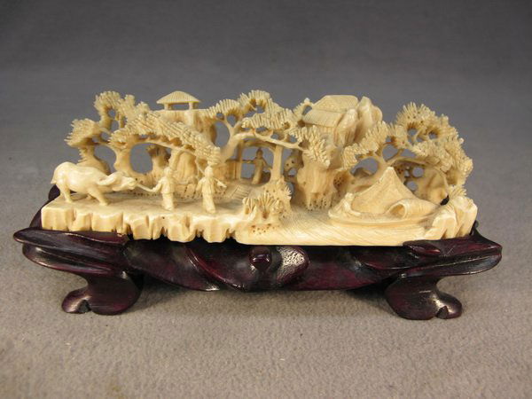 Chinese carved ivory scene: Chinese carved ivory scene on a wood base. 3 1/4" H x 7 1/4" W including base. Shipping in USA is $ 35.00. International bidders ask before bid.