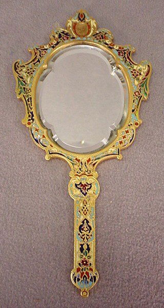 Old French champlevé bronze hand mirror: Old French champlevé bronze hand mirror. 11" H x 5 1/4" W. Packing & shipping in the USA is $ 35.00. International bidders ask for shipping before bid.