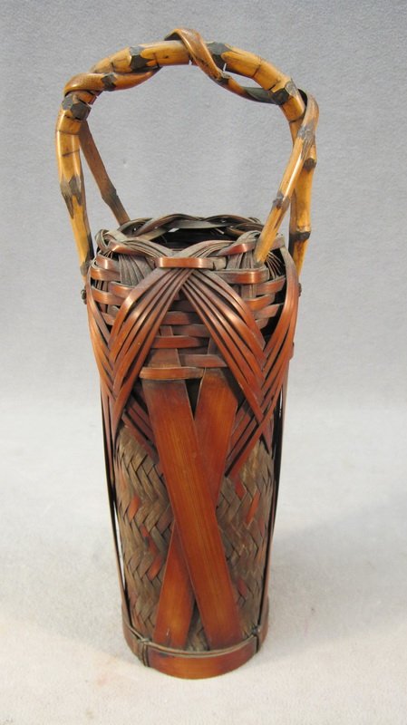 Antique Japanese Bamboo Ikebana basket: Antique Japanese Bamboo and rattan Ikebana basket. 16 1/2" H. Shipping in USA is $ 40.00. International bidders ask before bid