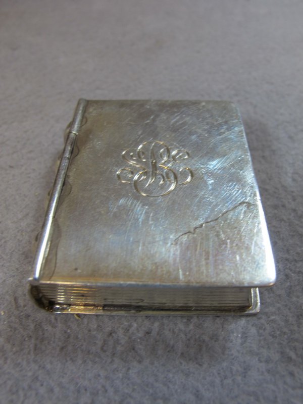 Tiffany & Co sterling pills box: Tiffany & Co sterling book pills box, marked. 7/16" H x 1 13/16" W x 1 9/16" D, weight: 42 grams / 1 toz 7 dwt. Shipping in USA is $ 8.00. International bidders ask before bid.
