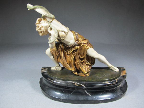 Claire COLINET (1880-1950) bronze & ivory statue: Claire COLINET (1880-1950) bronze & ivory statue on a marble base, signed & titled: " Snake Dancer ". 12 1/4" H, 9 1/2" H without base. Shipping in USA is $ 60.00.International bidder ask for shipping